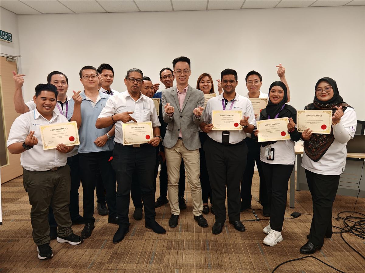 Subaru sales team holding certificates after a two-day programme