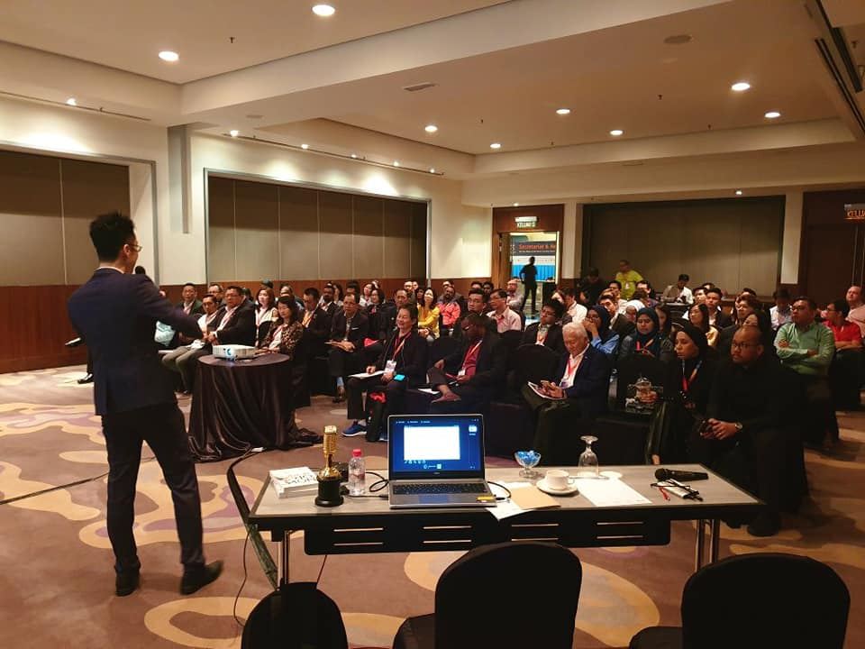 Marcus speaking at a business summit